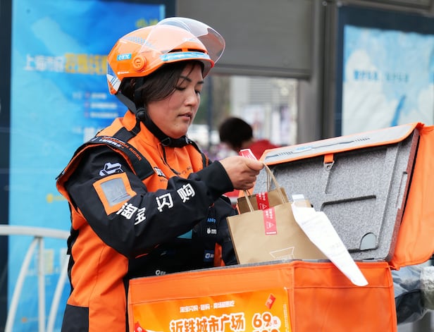 A Taobao Sanggou courier in Shanghai, China. /Courtesy of Xinhua Yonhap