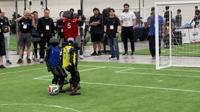 In a Robocup 2026 match on the 3rd, South Korea's AeiROBOT HERoEHs 170-cm Humanoid Alice5 faces Brazil's Talos Humanoid 120-cm robot in a soccer game. /Courtesy of Kim, Sua